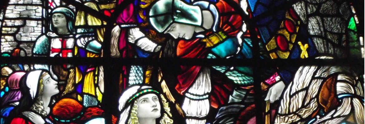 Stained glass image of knight and maiden, King Arthur's Great Halls Tintagel, Cornwall